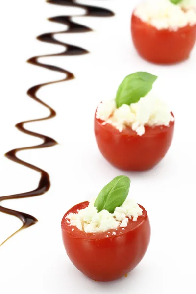 Cherry tomatoes stuffed with white cheese — Stock Photo, Image