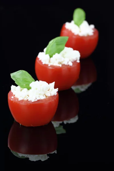 Cherry tomatoes stuffed with white cheese — Stock Photo, Image