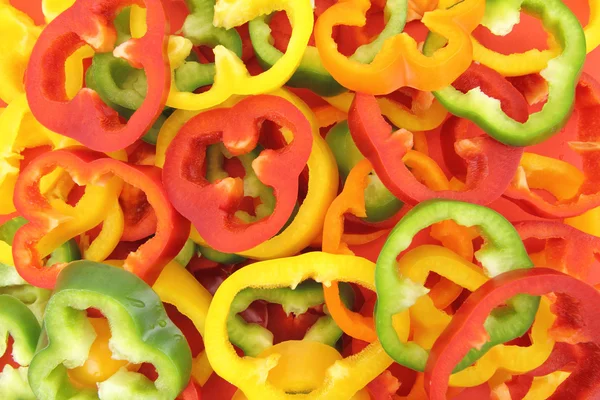 Background of fresh sliced peppers — Stock Photo, Image
