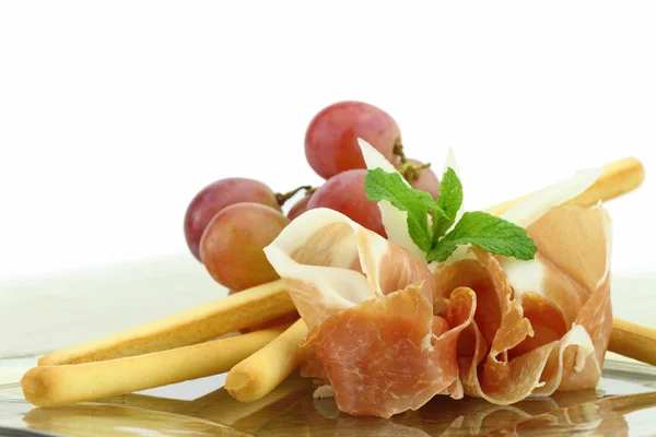 Prosciutto with grissini appetizer — Stock Photo, Image