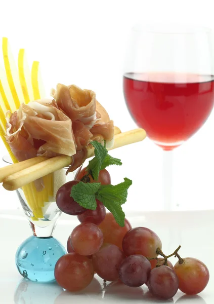 Gastronomische schotel met prosciutto en grissini — Stockfoto
