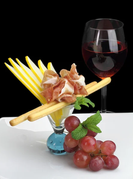 Gourmet dish with prosciutto and grissini — Stock Photo, Image