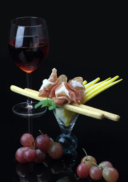 Gourmet dish with prosciutto and grissini — Stock Photo, Image