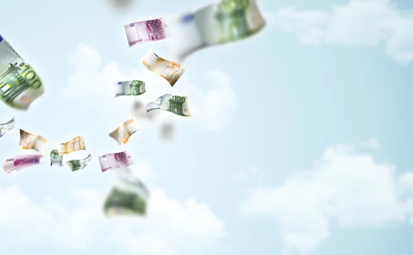 stock image Money falling in the sky background