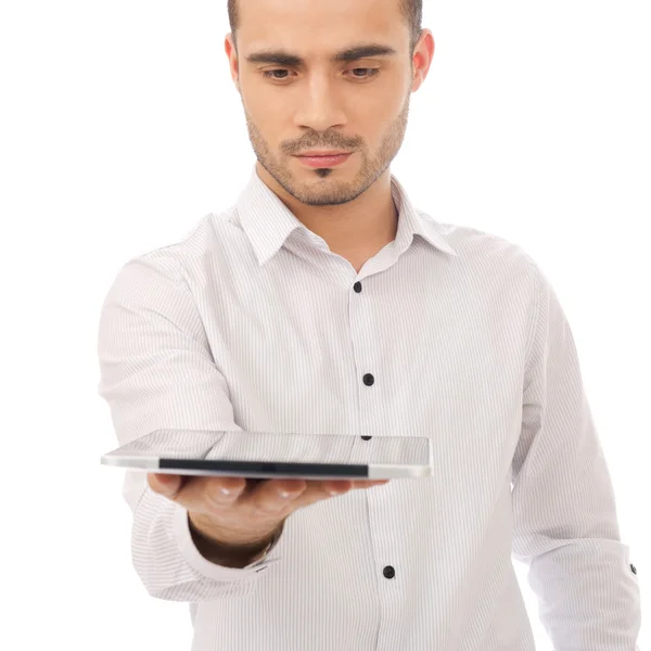 Homem animado segurando tablet pc isolado no fundo branco. Chee... — Fotografia de Stock