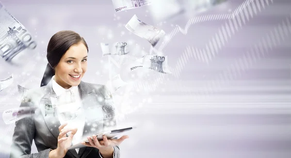 Portrait of a brunette woman with tablet computer - money appear — Stock Photo, Image