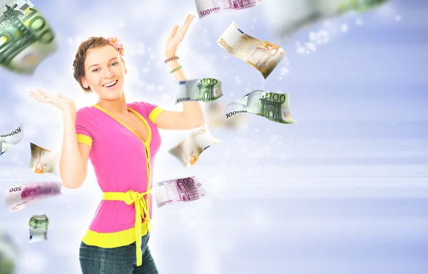 Woman standing with open arms amidst falling money — Stock Photo, Image
