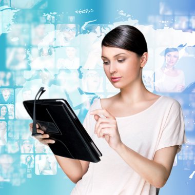 Portrait of young woman holding her tablet computer and communic clipart