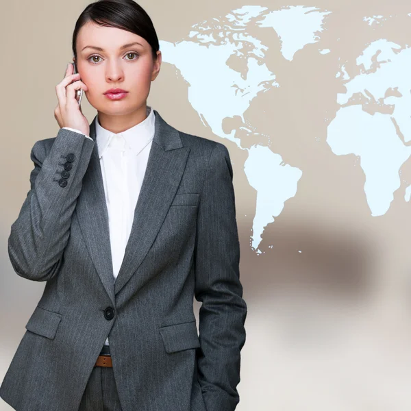 Portrait of beautiful business woman on the phone at her office — Stock Photo, Image