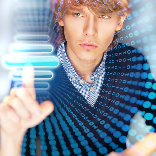 Young business man pressing a touchscreen button while working a — Stock Photo, Image