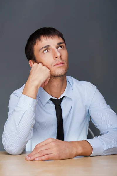 Portrait of an adult business man sitting in the office and dayd — Stock Photo, Image