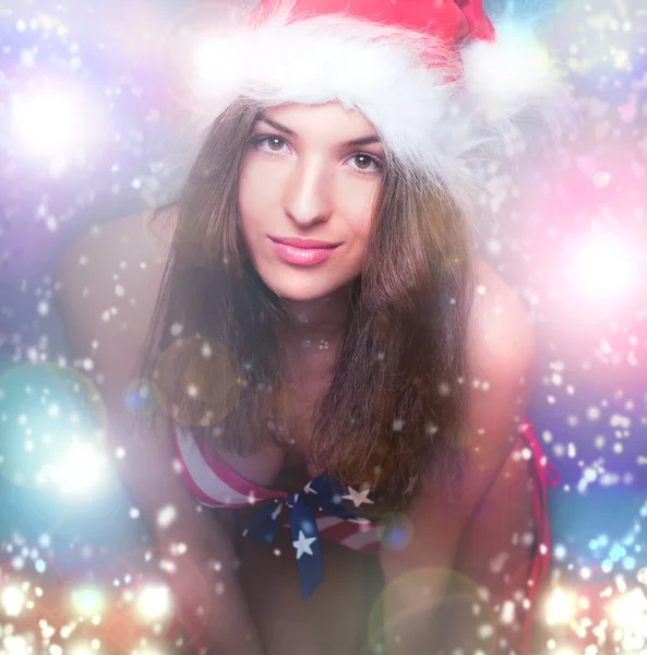 20-25 years old beautiful woman in christmas hat and swimsuit wi — Stock Photo, Image