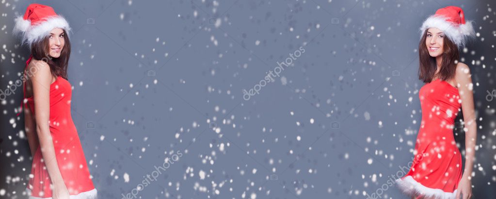 Portrait of two young twins women standing against each other. Copyspace for your text and logo between them. Snow falls