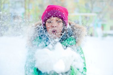 Christmas Girl.Winter woman Blowing Snow. Front View clipart