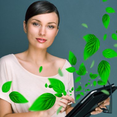 Portrait of young woman standing indoors at her office and worki clipart