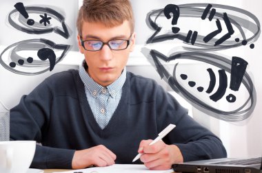 High school - Young male student write notes in classroom. Desig clipart