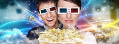 Portrait of young stylish modern couple wearing 3d glasses watch clipart