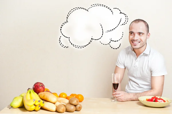 Portrait of a young man having a glass of wine while cooking. co — Stock Photo, Image