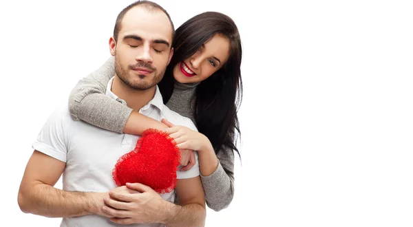 Счастливая молодая взрослая пара с красным сердцем на белом фоне, эмблема — стоковое фото