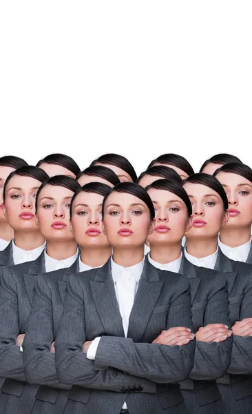 Many identical businesswomen clones. Businesswoman production co — Stock Photo, Image