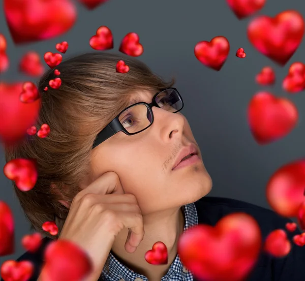 Image of young man thinking of his plans about Valentine day and — Stock Photo, Image