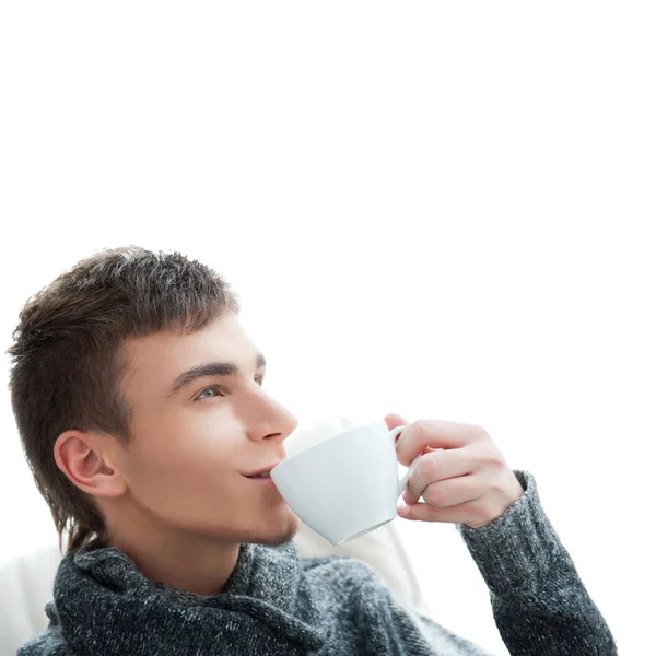Portrait of a young man drinking coffee and looking away, lots — Stock Photo, Image
