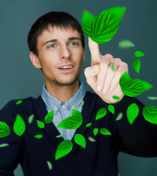 Portrait of young man sitting indoors at his office and working. — Stock Photo, Image