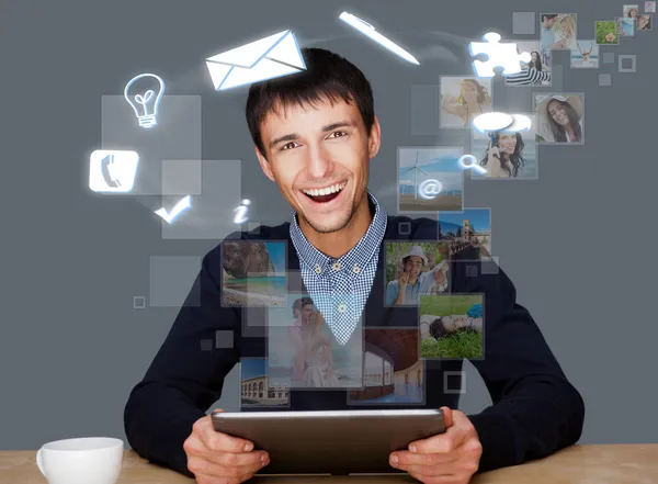 A businessman with icons floating around his head. Portrait of h — Stock Photo, Image