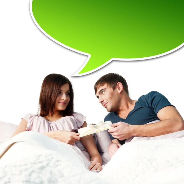 Closeup portrait of a happy young couple relaxing on the bed. Ma — Stock Photo, Image