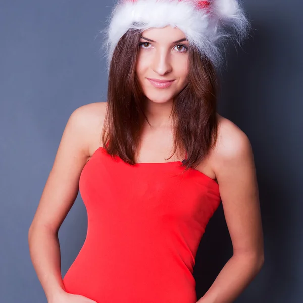 20-25 years od beautiful woman in christmas dress posing against — Stock Photo, Image