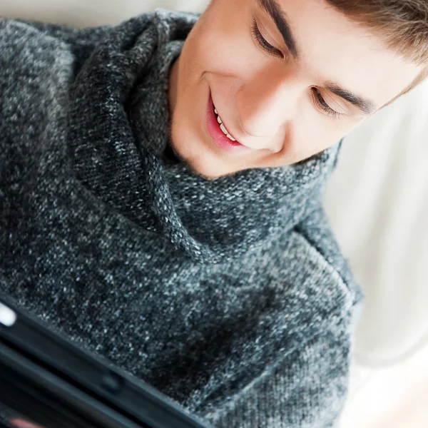 Happy young handsome man at home — Stock Photo, Image