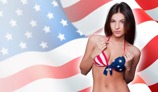 20-25 years old beautiful woman in swimsuit with american flag a Stock Photo