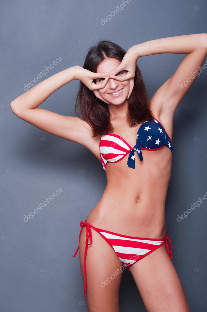 20-25 years old beautiful woman in swimsuit with american flag a Stock Photo  by ©HASLOO 8663463