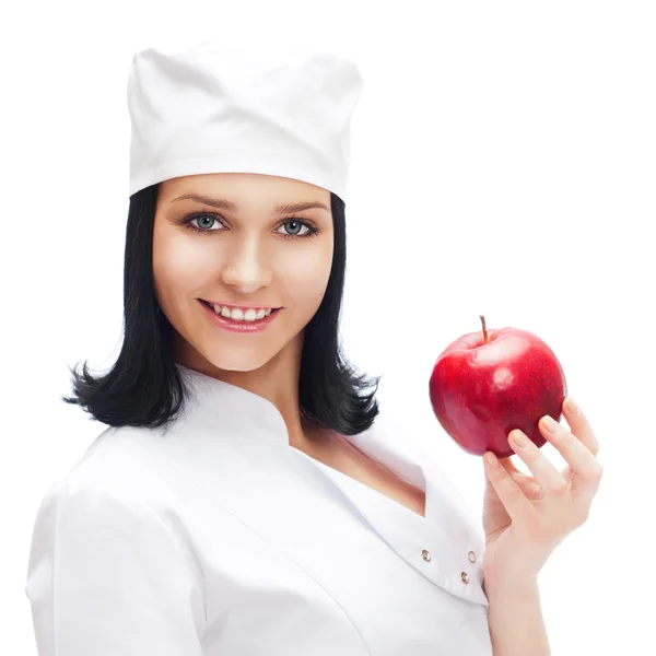 En kvinnlig läkare som innehar ett rött äpple isolerad på vit ba — Stockfoto
