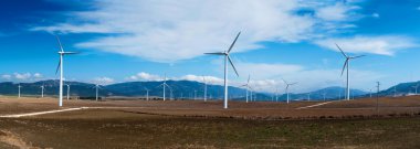 Windmills in summer landscape of Andalucia, Spain, Europe clipart