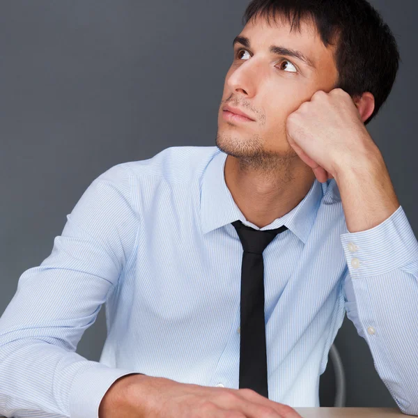 Portrait of an adult business man sitting in the office and dayd — Stock Photo, Image