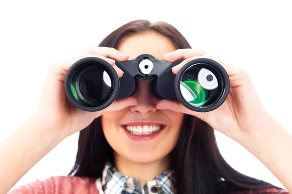 Frau blickt durch Fernglas isoliert auf weiß — Stockfoto