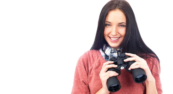 Happy young woman looking at camera and holding binoculars. Isolated on whi — Stock Photo, Image