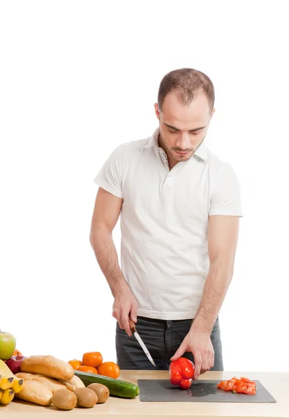 Adult smiling man cooking in the kitchen — Stock Photo, Image