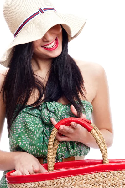 Portrait of a beautiful young woman wearing summer hat and holding handbag — Stock Photo, Image