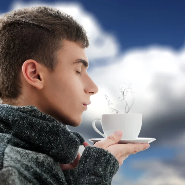 Portrait of a young man drinking coffee and breathing the smell — Stock Photo, Image
