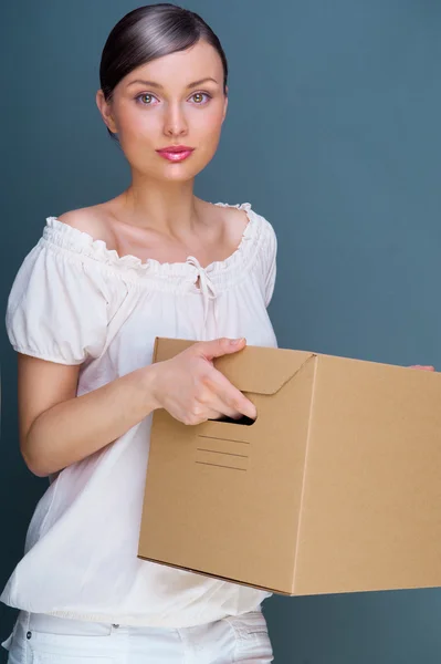 Close-up portrait of a young woman with box — Stock Photo, Image