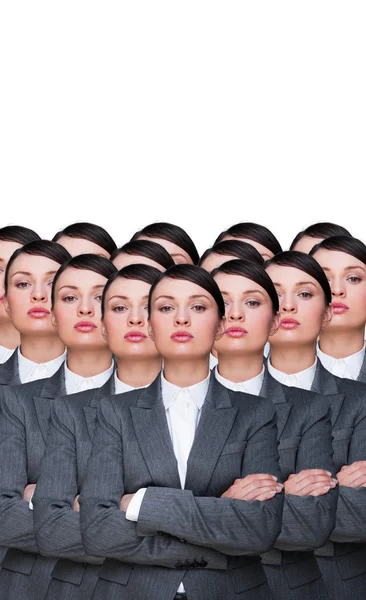 Many identical businesswomen clones. Businesswoman production concept. Army of workers ready for your business — Stock Photo, Image