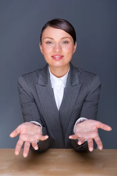 Smiling young business woman. In a modern office — Stock Photo, Image