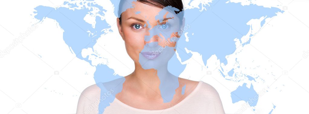 Portrait of young pretty woman looking at camera with map on foreground against white background