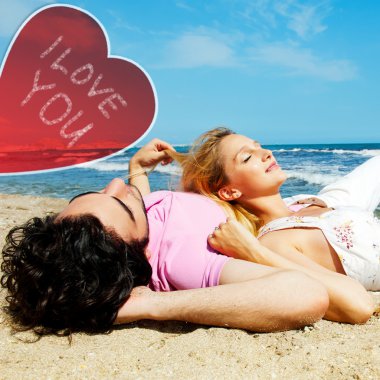 Young beautiful romantic couple relaxing on beach at sunny day. Heart and sign i love you clipart