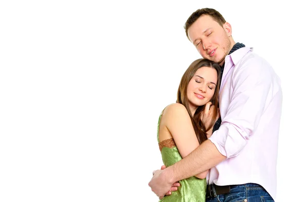 Retrato de jovem casal de pé juntos e abraçando — Fotografia de Stock
