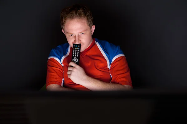 Portrait of young man watching tv translation of football game with his favourite team — Stock Photo, Image