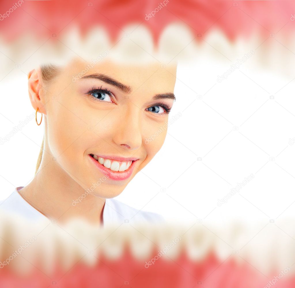 Pretty young female dentist looking inside patient's mouth view from inside