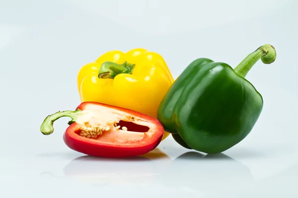 Green, Yellow and Cut Red Capsicums II — Stock Photo, Image